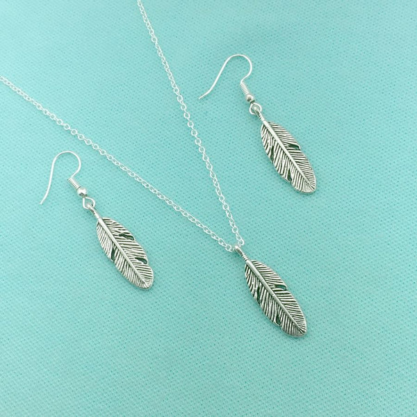 Beautiful Handcrafted Feather Charm Silver Necklace Set.