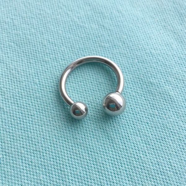 Sterilized Surgical Steel 10g Horseshoe to stop Ball Sinking in PA Piercing.
